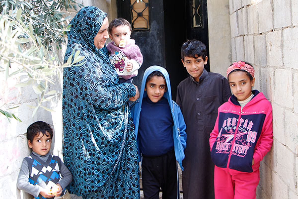 Noor, a Syrian refugee from Homs, is raising her nine children alone in Mafraq, Jordan.