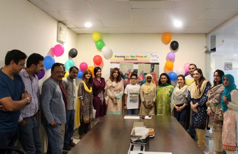 Pakistan’s staff celebrate Muhammad’s kind gesture of sponsoring a refugee’s studies.