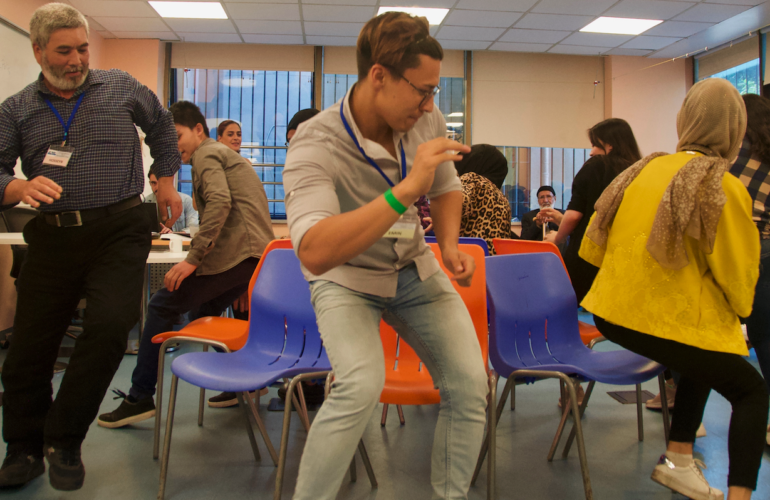 Refugees and ICMC staff take part in a Cultural Orientation session at the ICMC Resettlement Support Center (RSC) in Istanbul in 2023