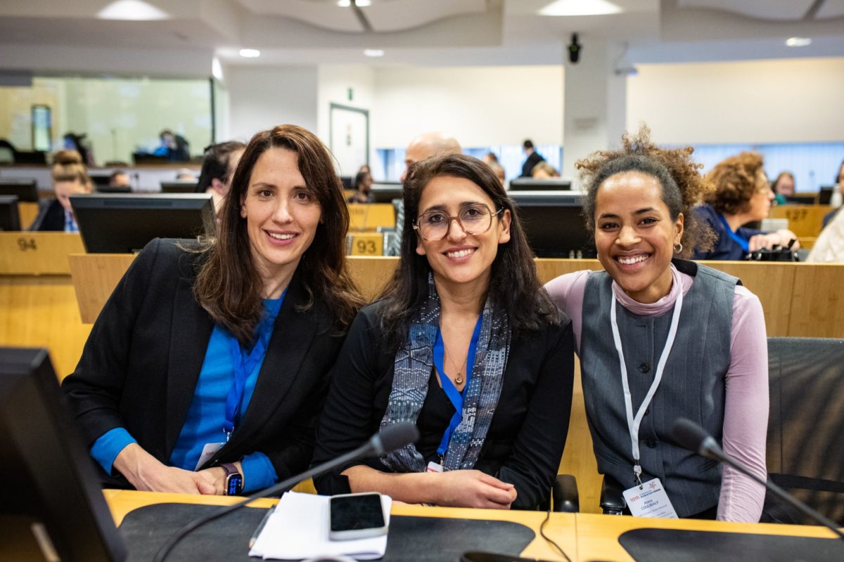 ICMC’s Gabriela Agatiello (left) & Anna Coulibaly (right) at the 2025 European Migration Forum (EMF), with Fatemeh Jailani of SINGA