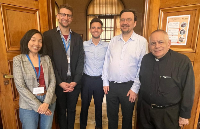 In May 2024, the Dicastery for Promoting Integral Human Development, ICMC, and the ILO convened the global ‘Care is Work, Work is Care’ consultation in Rome. Photo: Athena Peralta (left), Ignacio Alonso Alasino (center) and Pierre Martinot-Lagarde (second left), with participants at the ‘Care is Work, Work is Care’ consultation © Future of Worker after Laudato Si’ (FOWLS) Project