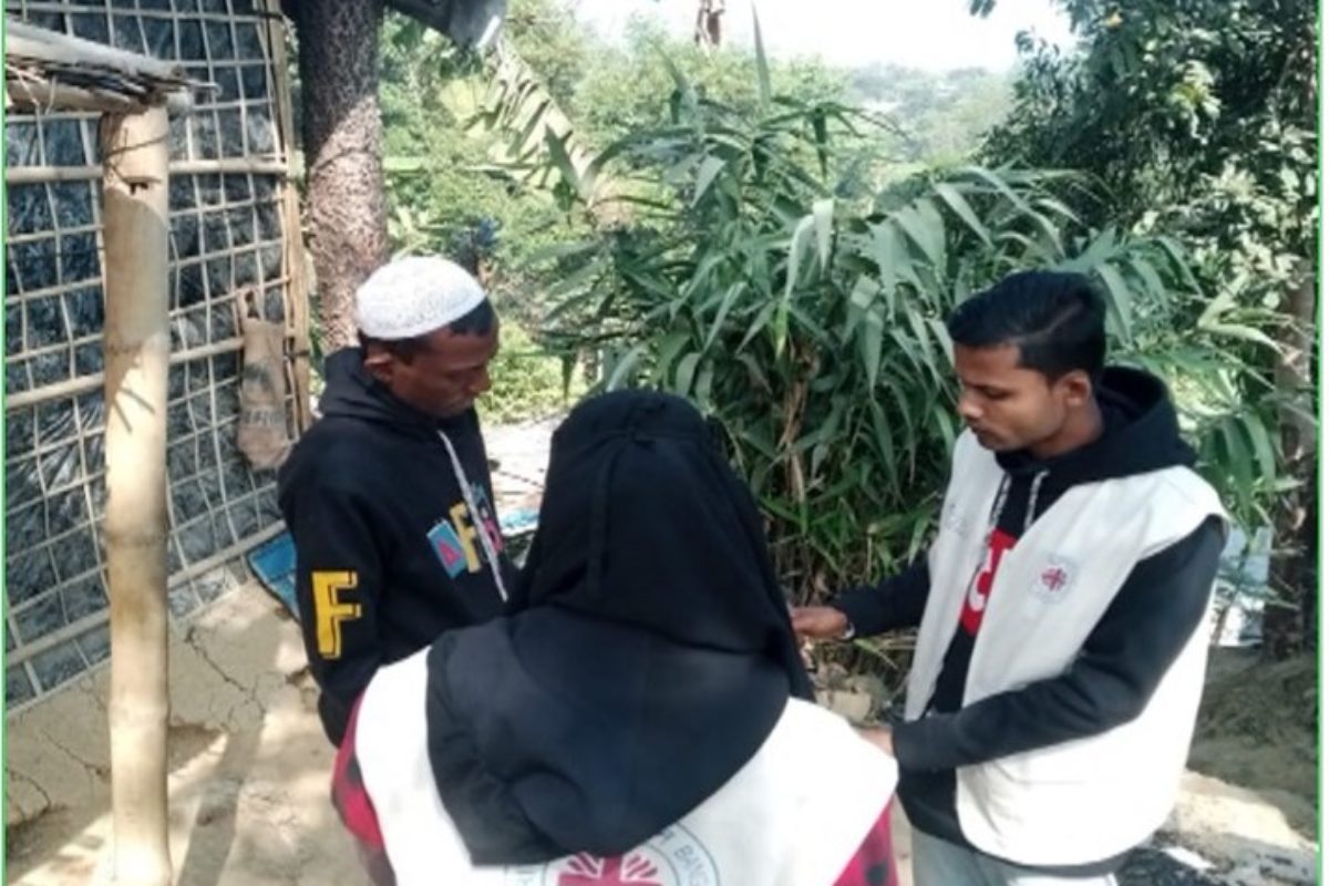 Community volunteers trained by Caritas Bangladesh conduct a trafficking awareness household visit to a Rohingya refugee family