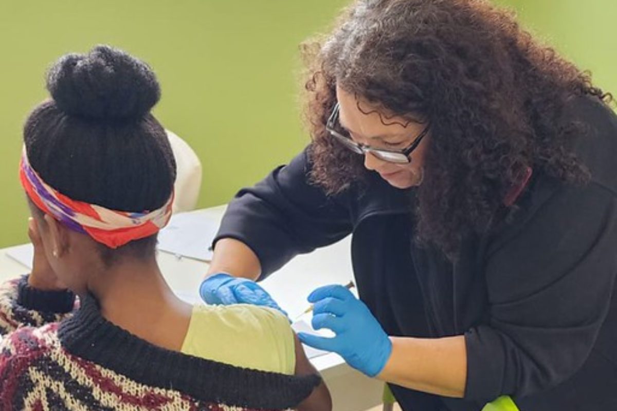A clinic staff member administers a vaccine at St Charles Clinic, Johannesburg, South Africa
