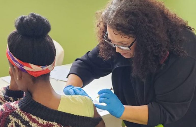 A clinic staff member administers a vaccine at St Charles Clinic, Johannesburg, South Africa