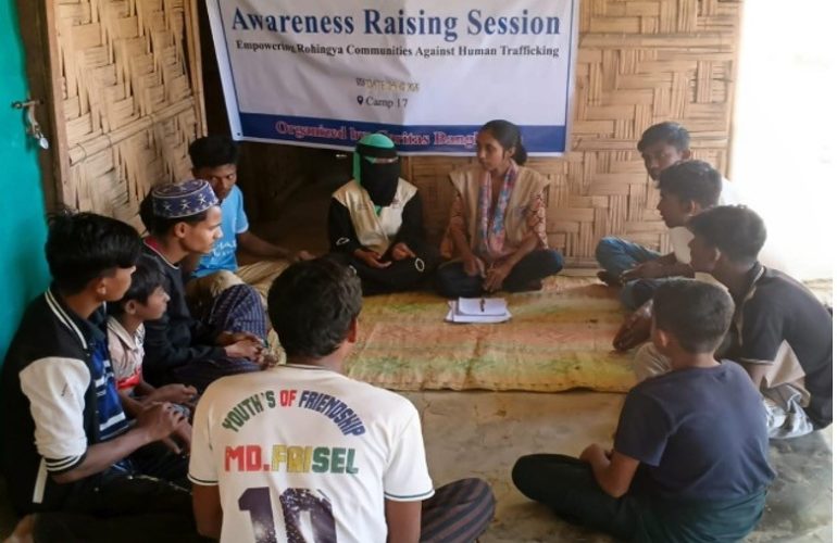 In 2025, ICMC support enabled Caritas Bangladesh to carry out 424 household visits, building awareness of human trafficking risks amongst 2,126 Rohingya refugee family members. Photo: Trained community volunteers conduct a household visit to a Rohingya family in Bangladesh.